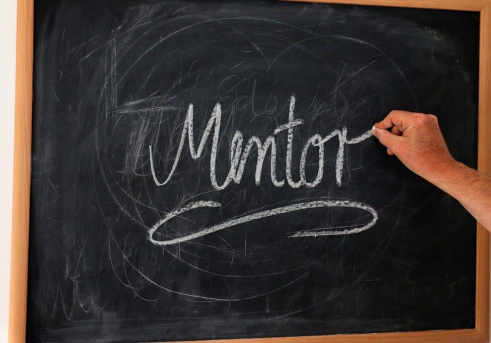 the word "mentor" written on chalkboard